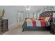 Spacious primary bedroom features a large bed with decorative pillows, ceiling fan, and decoratively painted walls at 1046 Upchurch Farm Ln, Cary, NC 27519