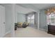 Sitting area with two comfortable chairs, small table, and large windows offering ample natural light at 1046 Upchurch Farm Ln, Cary, NC 27519