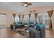 Sunroom with wicker furniture, ceiling fan, and large windows for natural light at 1046 Upchurch Farm Ln, Cary, NC 27519