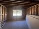 Unfinished basement is ready for customization, featuring window and natural light at 107 Parkland Dr, Pittsboro, NC 27312