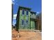 New construction of a modern two-story home with large windows and Zip System sheathing at 107 Parkland Dr, Pittsboro, NC 27312
