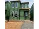 New construction of a modern two-story home with large windows and Zip System sheathing at 107 Parkland Dr, Pittsboro, NC 27312