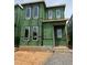 New construction of a modern two-story home with large windows and Zip System sheathing at 107 Parkland Dr, Pittsboro, NC 27312