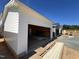 New construction garage with exposed beams and garage door opening at 107 Parkland Dr, Pittsboro, NC 27312