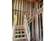 Unfinished staircase construction with exposed wooden studs and framing at 107 Parkland Dr, Pittsboro, NC 27312