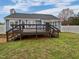 Backyard featuring deck, grass and perimeter fencing at 108 New Castle Ct, Youngsville, NC 27596