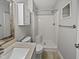 Bathroom featuring shower and tub, modern fixtures and vanity at 108 New Castle Ct, Youngsville, NC 27596