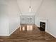 Spacious living room with a fireplace, vaulted ceiling, and hardwood floors throughout at 108 New Castle Ct, Youngsville, NC 27596