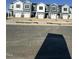 Row of newly constructed townhomes featuring multiple units with individual garages and modern exteriors at 11 Silver Pne Dr, Angier, NC 27501
