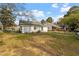 Spacious backyard view showing the exterior of the home with siding and well-kept grass at 1103 Gaston St, Smithfield, NC 27577
