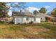 Exterior view of home showcasing the backyard with grass and good sun exposure for outdoor activities at 1103 Gaston St, Smithfield, NC 27577