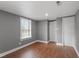 Bedroom featuring hardwood floors, a closet, and a window for natural light at 1103 Gaston St, Smithfield, NC 27577