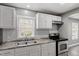 Close up of a renovated kitchen, showcasing modern finishes, appliances, and countertop detail at 1103 Gaston St, Smithfield, NC 27577