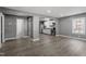 Modern open kitchen featuring stainless steel appliances, white cabinets, and recessed lighting, seamlessly connected to the living area at 1103 Gaston St, Smithfield, NC 27577