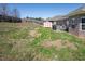 Fenced backyard with patio, grill and storage shed offer ample space for outdoor living at 1176 Andrews Ct, Creedmoor, NC 27522