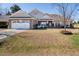 Charming single-story brick home with a well-maintained front yard and two-car garage at 1176 Andrews Ct, Creedmoor, NC 27522