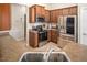 Modern kitchen with stainless steel appliances, brown cabinets and countertops at 1176 Andrews Ct, Creedmoor, NC 27522