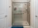 Modern shower with glass doors, two shower heads and tiled walls at 1176 Andrews Ct, Creedmoor, NC 27522