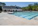 Large outdoor swimming pool with lap lanes and a spacious deck area for community enjoyment at 1176 Andrews Ct, Creedmoor, NC 27522