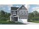 Charming two-story home with stone accents, a two-car garage, and a well-manicured lawn at 1217 Coral Cay Bnd, Wake Forest, NC 27587