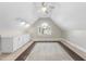 Finished attic space with built-ins, ceiling fan and natural lighting at 1301 Merrington Cir, Raleigh, NC 27615