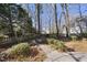 Landscaped backyard with stone walkway and privacy fence at 1301 Merrington Cir, Raleigh, NC 27615