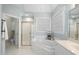 Bathroom featuring a tiled shower, garden tub with jets, and white countertops at 1301 Merrington Cir, Raleigh, NC 27615