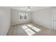 Bright bedroom with a ceiling fan and a large window at 1301 Merrington Cir, Raleigh, NC 27615