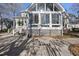 Back of house showing a sunroom addition and patio at 1301 Merrington Cir, Raleigh, NC 27615