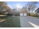 Charming brick home with well-kept lawn and a two-car garage, bathed in sunlight at 1301 Merrington Cir, Raleigh, NC 27615
