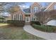 Beautiful brick home with well-maintained landscaping, walkway and shutters at 1301 Merrington Cir, Raleigh, NC 27615