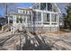Back of house showing a sunroom addition and patio at 1301 Merrington Cir, Raleigh, NC 27615