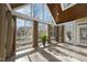 Large sunroom with tile floors, many windows and a wood ceiling at 1301 Merrington Cir, Raleigh, NC 27615