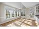 Bright sunroom featuring hardwood floors, large windows and lots of natural sunlight at 1301 Merrington Cir, Raleigh, NC 27615