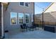 A charming outdoor patio with stylish seating, string lights, and a modern privacy screen at 140 Ashberry Ln, Franklinton, NC 27525