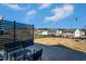 Beautiful backyard featuring modern seating, a privacy screen, fire pit, and well-maintained lawn at 140 Ashberry Ln, Franklinton, NC 27525