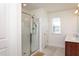 Bright bathroom with a glass-enclosed shower and a double sink vanity at 140 Ashberry Ln, Franklinton, NC 27525