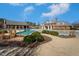 Resort-style pool with lush landscaping and brick clubhouse in a Gathering-friendly community at 140 Ashberry Ln, Franklinton, NC 27525