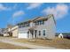 Two-story home with gray siding, black shutters, and a well-manicured front yard at 140 Ashberry Ln, Franklinton, NC 27525