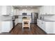 Stylish kitchen featuring white cabinets, stainless steel appliances, and granite countertops at 140 Ashberry Ln, Franklinton, NC 27525