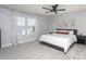 Serene main bedroom with a king-size bed, neutral tones, and a view from the window at 140 Ashberry Ln, Franklinton, NC 27525