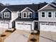 Aerial view of new townhomes with 2-car garages, new landscaping at 164 Kobus Ct, Garner, NC 27529