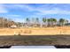 View of expansive backyard in new community with future construction, featuring trees and blue sky at 164 Kobus Ct, Garner, NC 27529