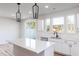Bright kitchen featuring an island, stainless steel appliances and modern finishes at 164 Kobus Ct, Garner, NC 27529