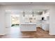 Open concept kitchen with an island, stainless steel appliances and hardwood floors at 164 Kobus Ct, Garner, NC 27529