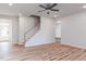 Inviting living room with staircase, sleek flooring, and ample natural light creates a warm and welcoming space at 164 Kobus Ct, Garner, NC 27529