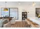 Open living space features a dining area, modern kitchen, and barstool seating at 168 Kobus Ct, Garner, NC 27529