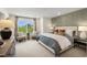 Bright main bedroom features a decorative accent wall, neutral tones, and a window with a view of the outdoors at 168 Kobus Ct, Garner, NC 27529