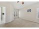 Spacious carpeted bedroom with ample natural light and an ensuite bathroom at 1709 Heisser Ln, Fuquay Varina, NC 27526