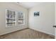 Cozy bedroom with carpet and lots of natural light streaming through bright windows at 1709 Heisser Ln, Fuquay Varina, NC 27526